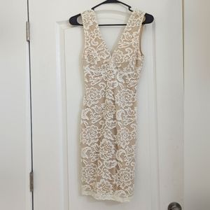 Lulu's size Small White Lace lining with light brown underneath.